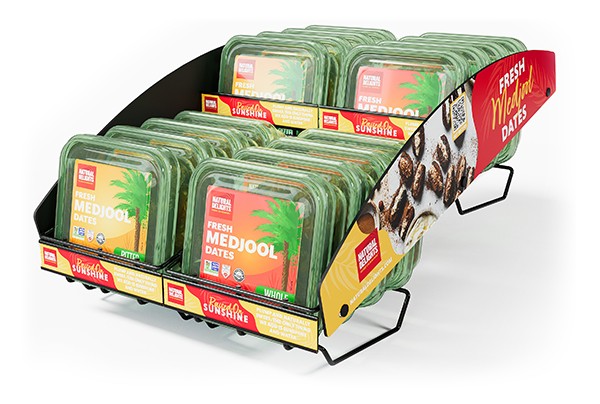 Retailers can leverage endcaps or shipper displays featuring holiday recipe inspiration like stuffed or wrapped dates to showcase the product’s versatility and drive impulse purchases